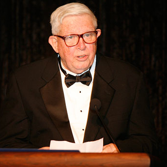 photo of Wallace Cleland at a podium