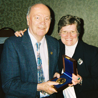 photo of Bernard A. Henning, Sr. holding a medal