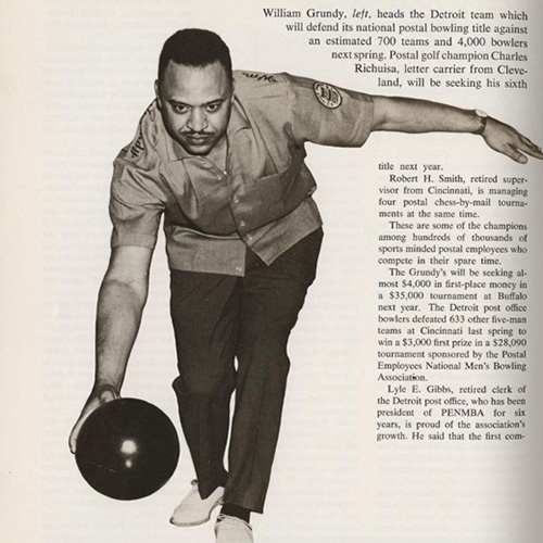 A man rolling a bowling ball