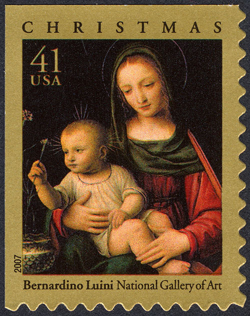 Postage stamp featuring a painting of the Virgin Mary with the Christ child seated in her lap as he turns to grasp a carnation growing in a pot nearby.