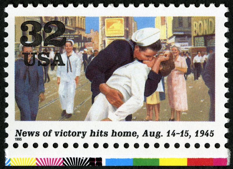 News of Vicotry Hits Home stamp with image of a sailor kissing a woman in Times Square