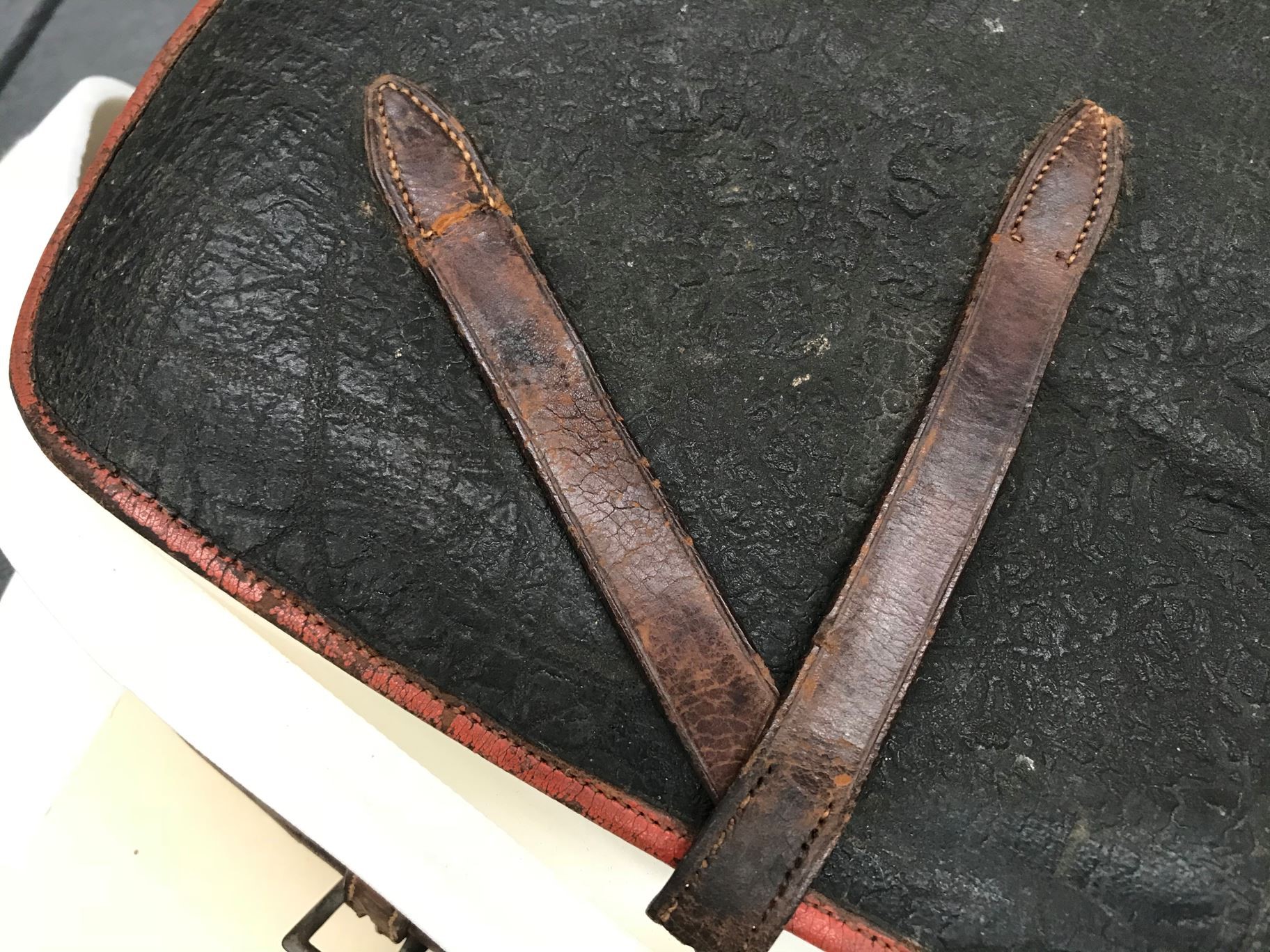 Close up photograph of the bag’s leather straps, now fixed.