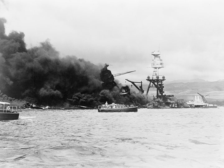 USS Arizona in flames following the Japanese air attack on Pearl Harbor, Hawaii, December 7, 1941.