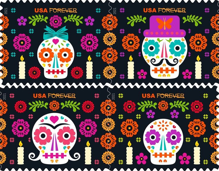 Four Day of the Dead stamps featuring illustrations of sugar skulls and flowers