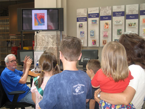 John Engeman showing his computer stamp design techniques to a group of visitors at the National Postal museum July 2007