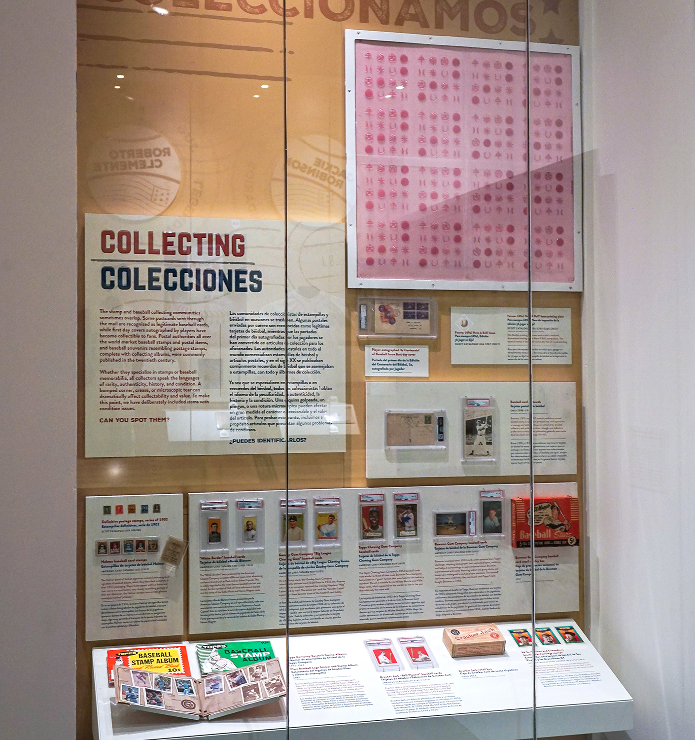 Display cases containing objects related to stamp production and collecting