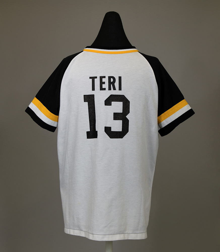 Back of T-shirt with softball team player’s name and number at center, “Teri 13”