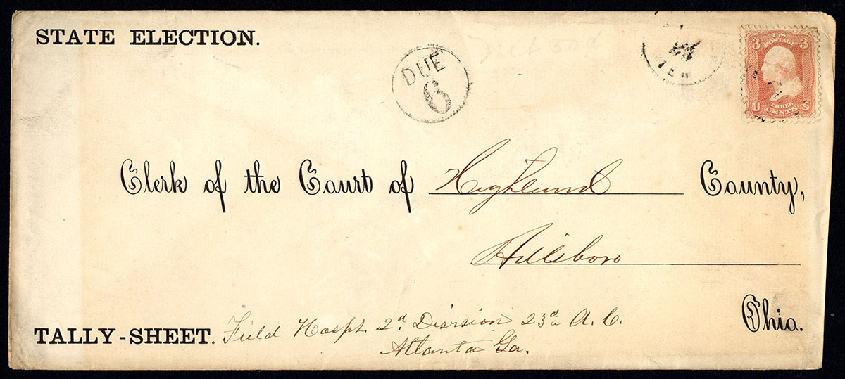 Envelope with printing, handwriting, postal marking, and postage stamp.