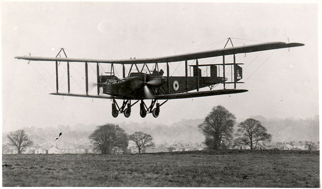 Photograph of O/400 airplane landing in a field