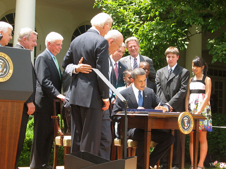 President Obama at the White House signing the Tobacco Control Act – 2009.