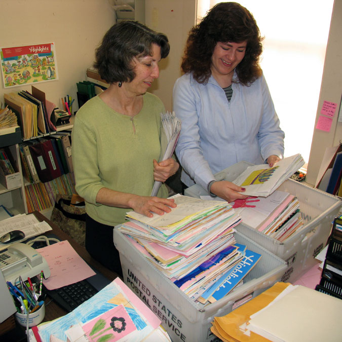 Highlights editors looking at mail.