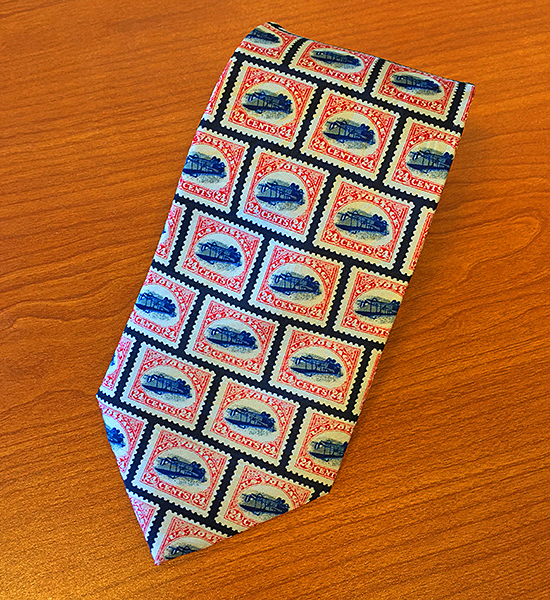A tie depicting numerous Inverted Jenny stamps.